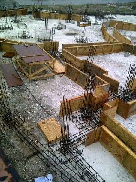 Aerial view of foundation formwork and rebar cages ready for concrete pour