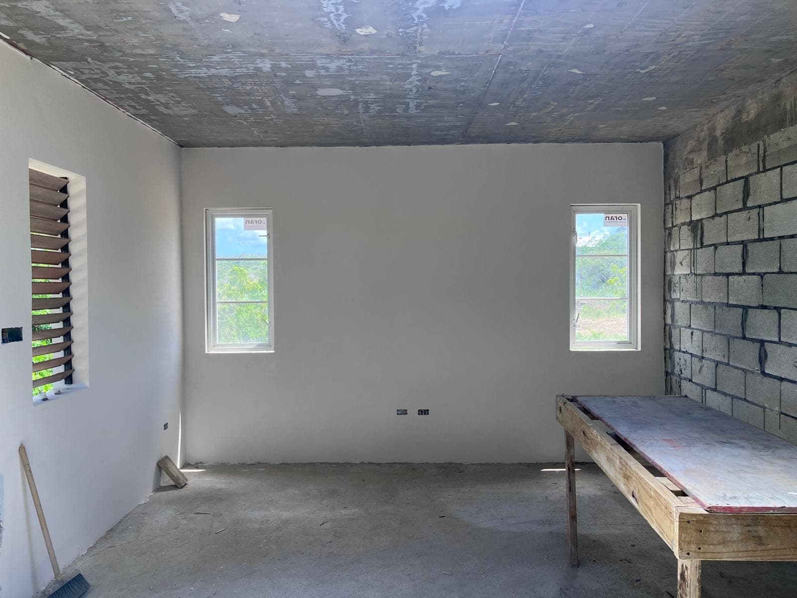 Interior room with one exposed block wall and plastered walls elsewhere