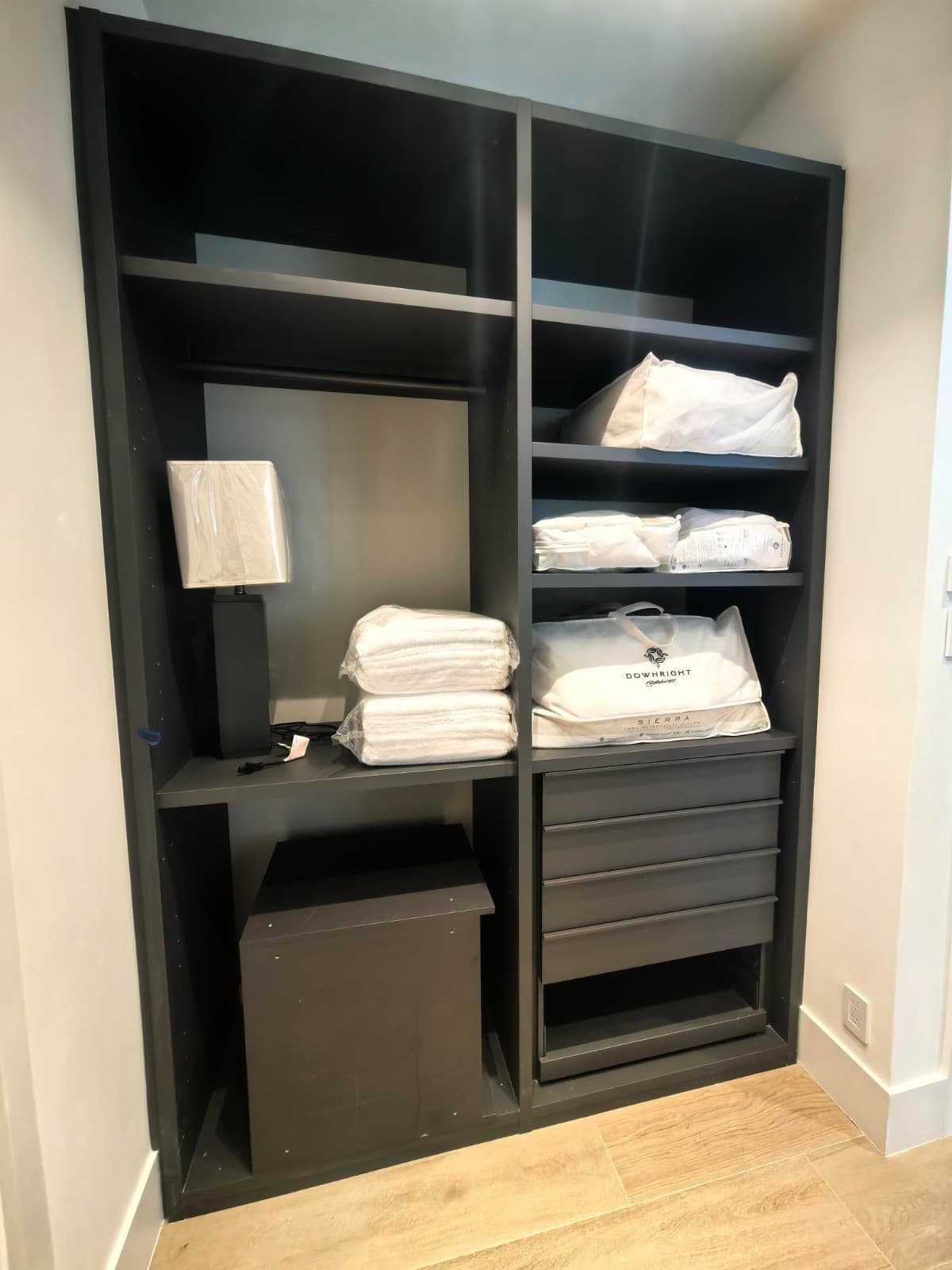 Built-in closet storage with linens prepared for move-in