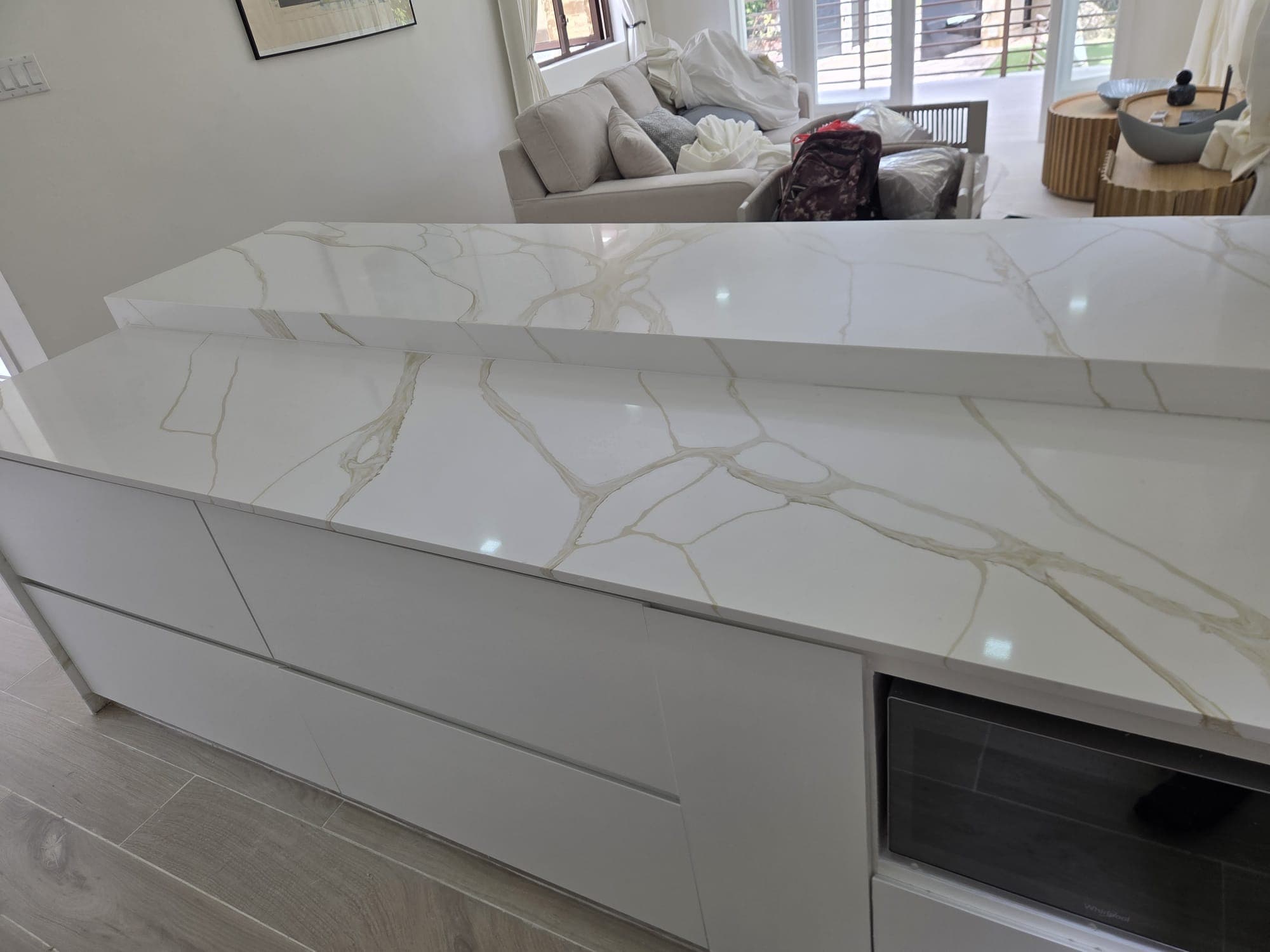 Living area countertop and seating detail, furniture wrapped for move-in