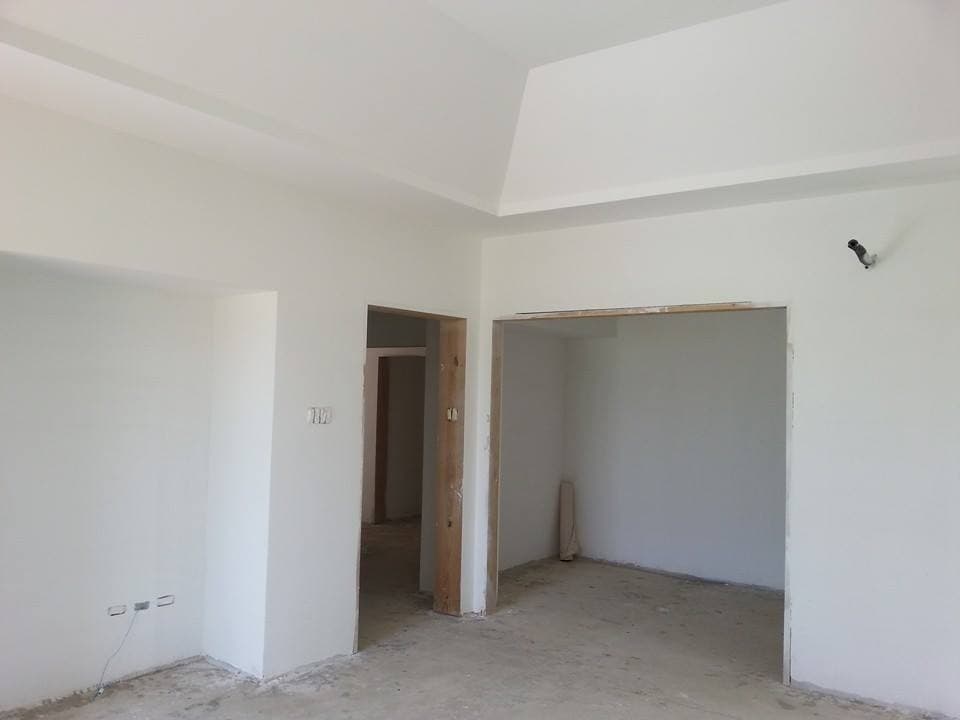 Interior room at plaster stage with exposed doorway framing