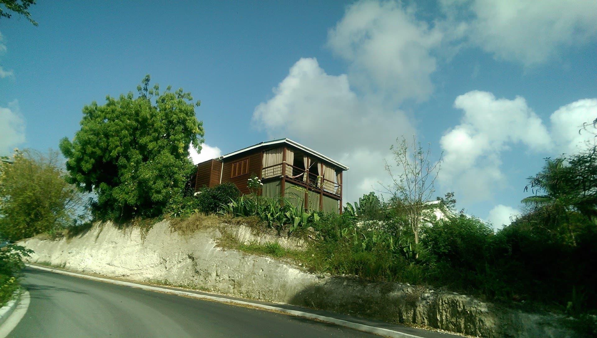 Timber structure renovation project on a hillside site in Barbados