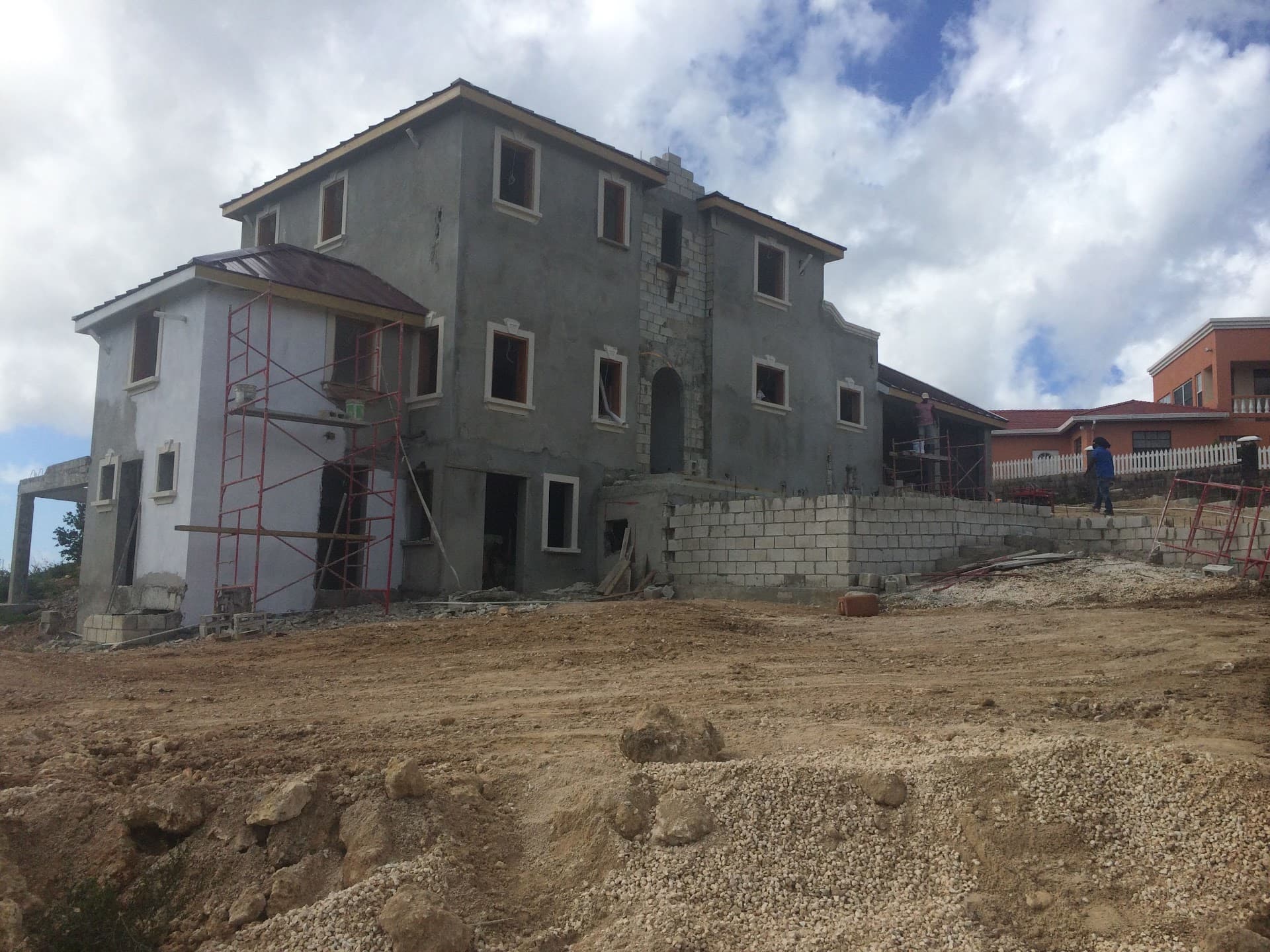 Two-storey residence under construction with scaffolding in place, Barbados