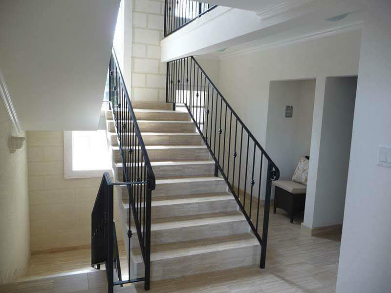 Interior staircase with wrought-iron balustrade