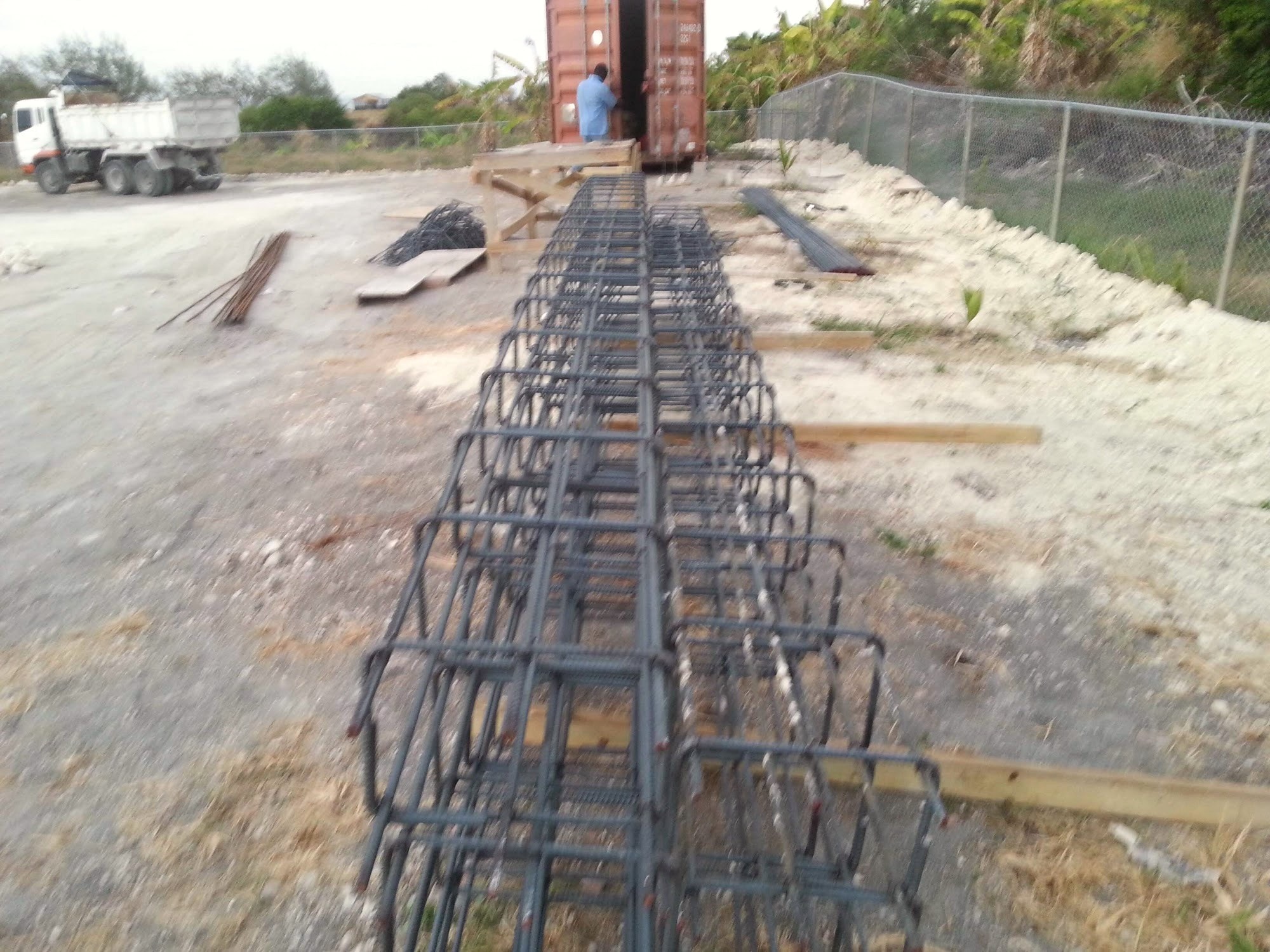 Rebar cage laid out ahead of a concrete pour on a Barbados construction site