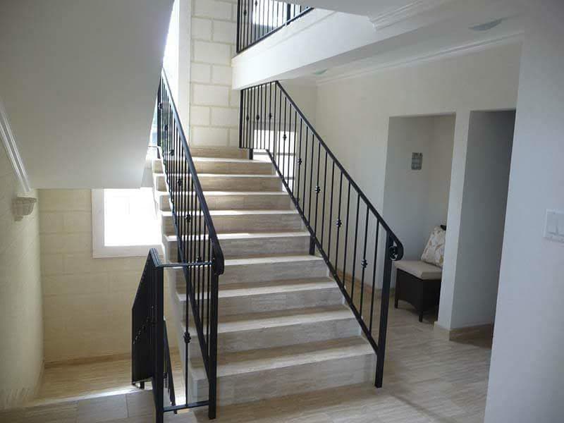 Interior staircase with wrought-iron balustrade