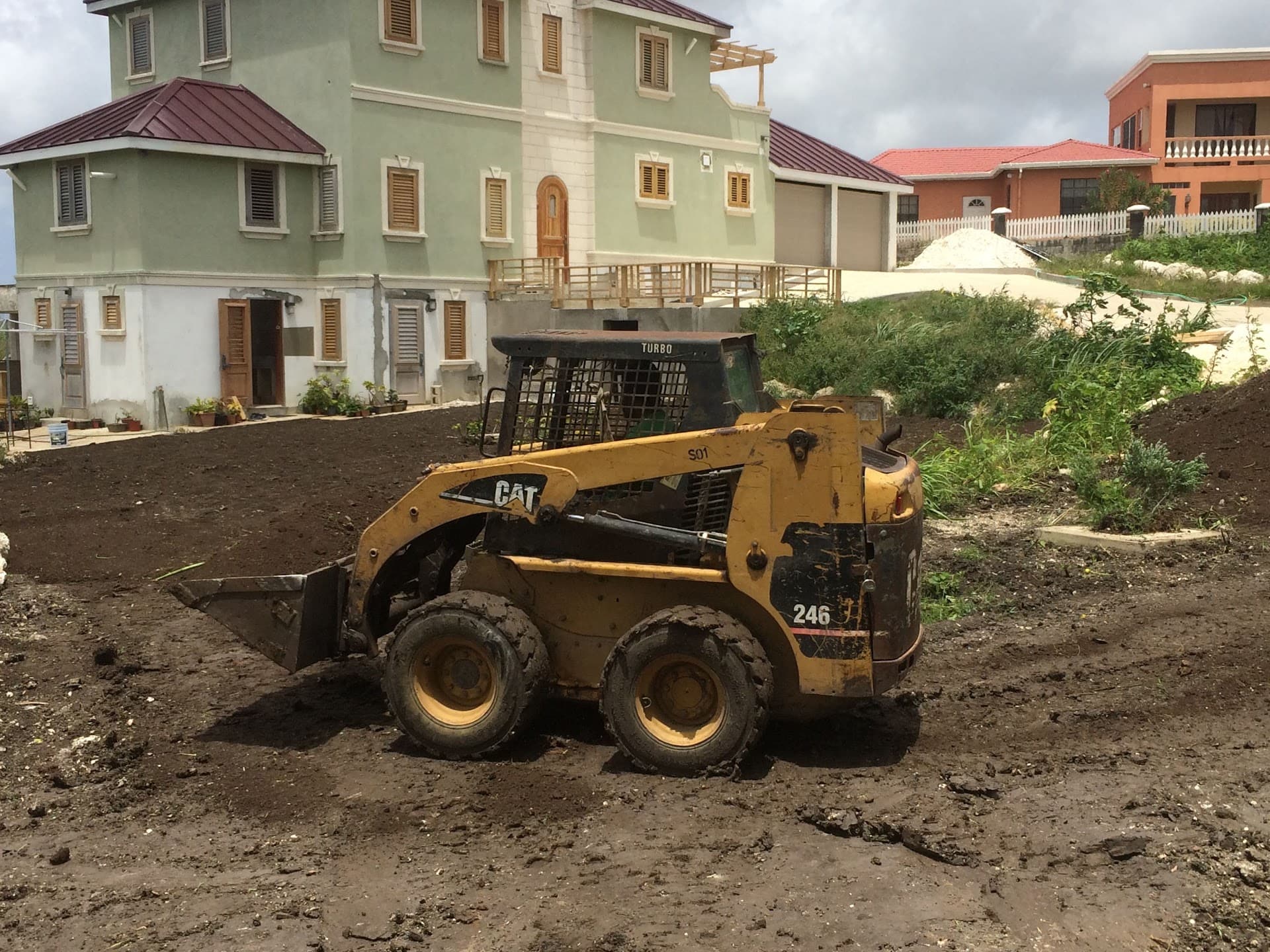 Graded and prepared lot ready for landscaping in front of a residence