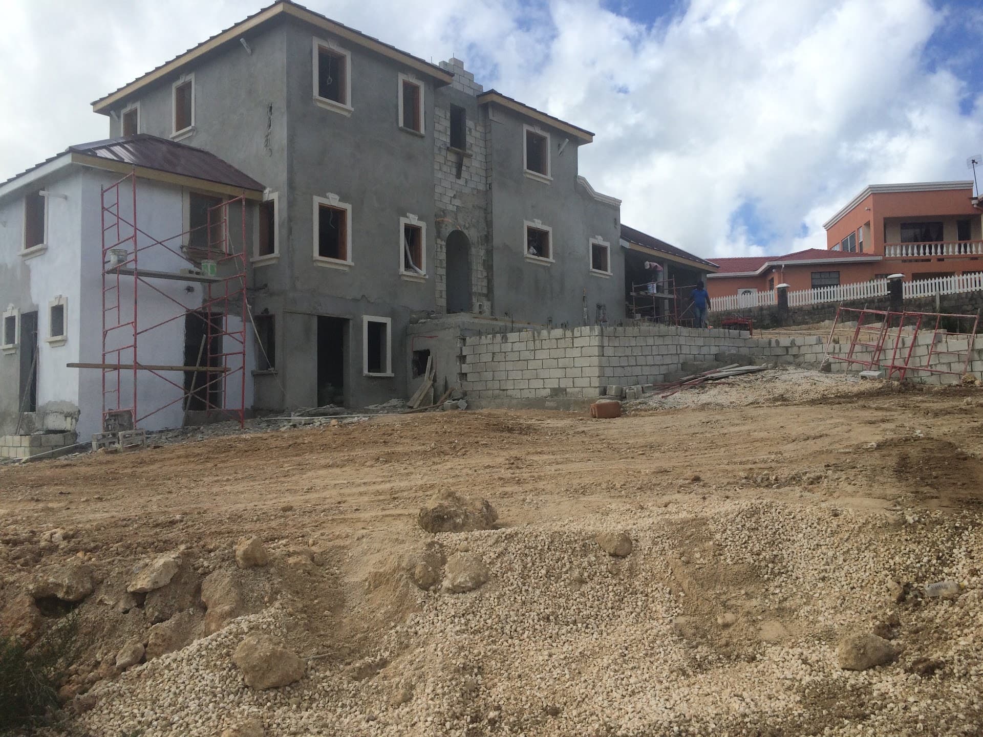 Same residence under construction, alternate elevation showing scaffold and window openings
